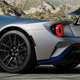 The rear of a silver and blue Ford GT Mk II